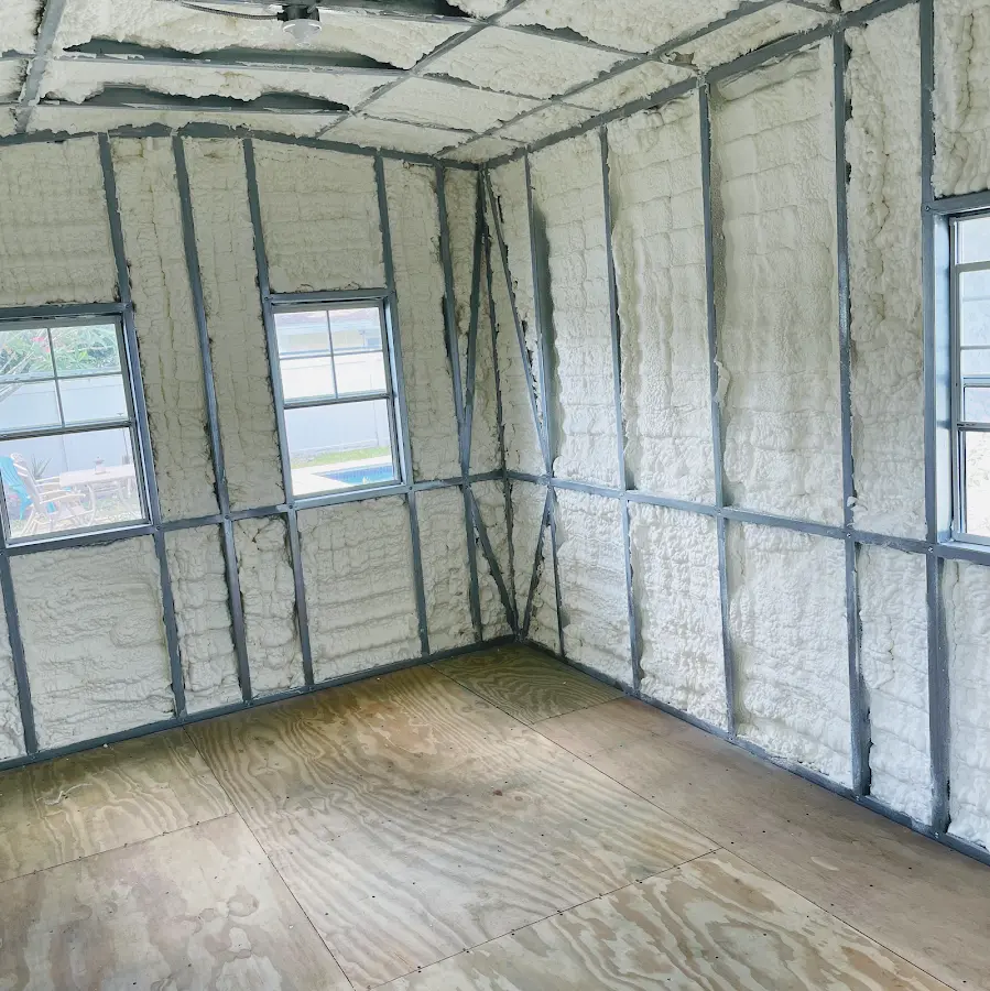 Closed-cell spray foam insulation applied to wall cavities in a residential project in Slinger